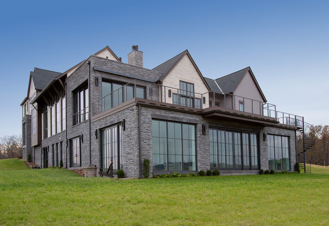 Custom Home with brick and Stone and lots of windows
